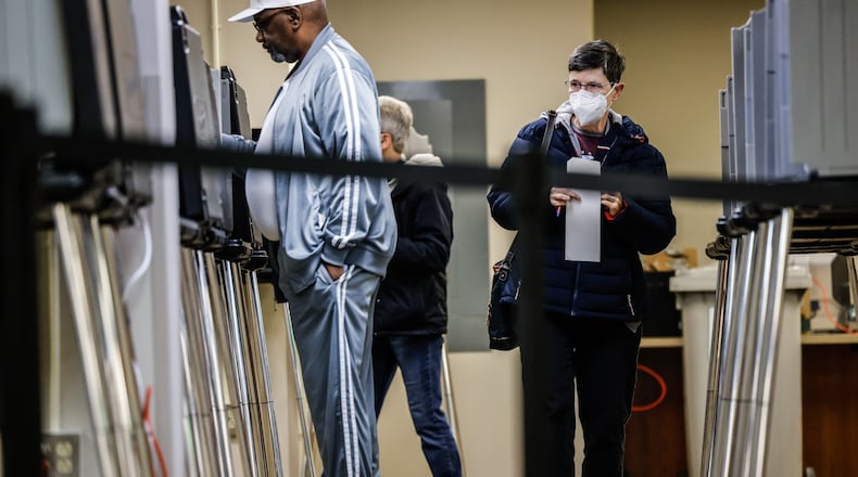 Janice James, right, cast her early ballot at the Montgomery County Board of Elections on West Third St. Thursday April 28, 2022. JIM NOELKER/STAFF