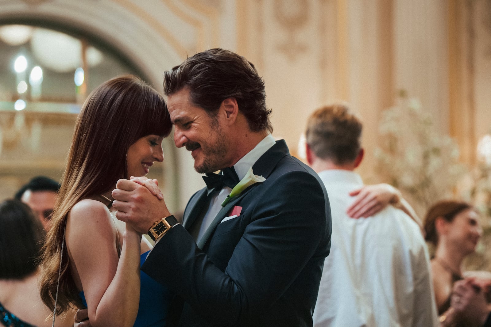 This image released by A24 shows Dakota Johnson, left, and Pedro Pascal in a scene from "Materialists." (A24 via AP)