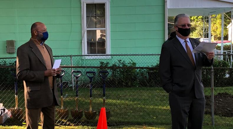 Gammon House president Dale Henry, left, and Rotary Club of Springfield president Mark Roberts address the crowd gathered at Springfield's Gammon House for the groundbreaking for the construction of a concrete accessible ramp on Tuesday, Sept. 29. BRETT TURNER/CONTRIBUTOR
