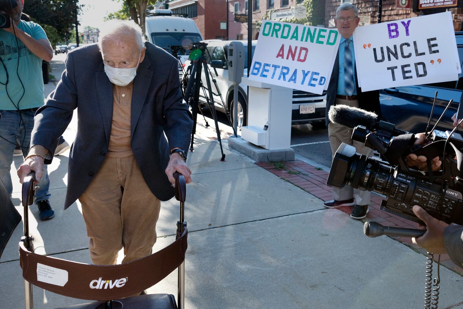 FILE - Former Cardinal Theodore McCarrick, left, arrives at Dedham District Court, Friday, Sept. 3, 2021, in Dedham, Mass. (AP Photo/Michael Dwyer, File)