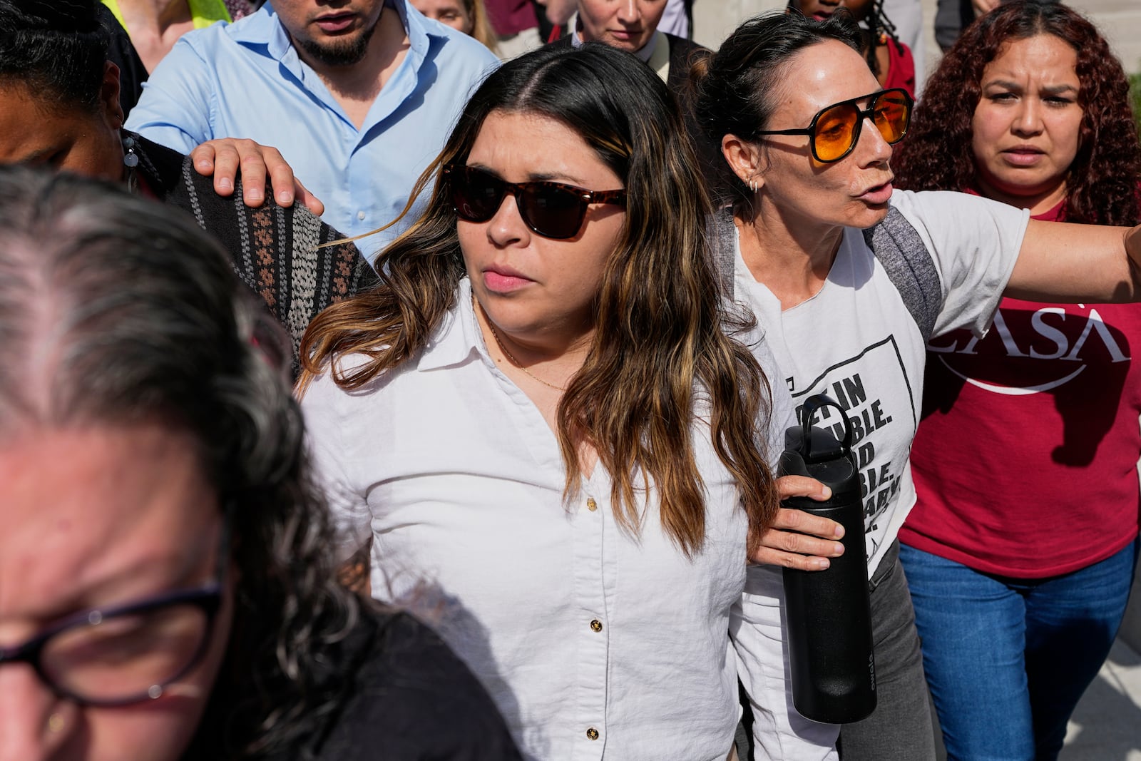 Jennifer Vasquez Sura, center left, wife of Kilmar Abrego Garcia leaves the federal courthouse Wednesday, June 25, 2025, in Nashville, Tenn. (AP Photo/George Walker IV)