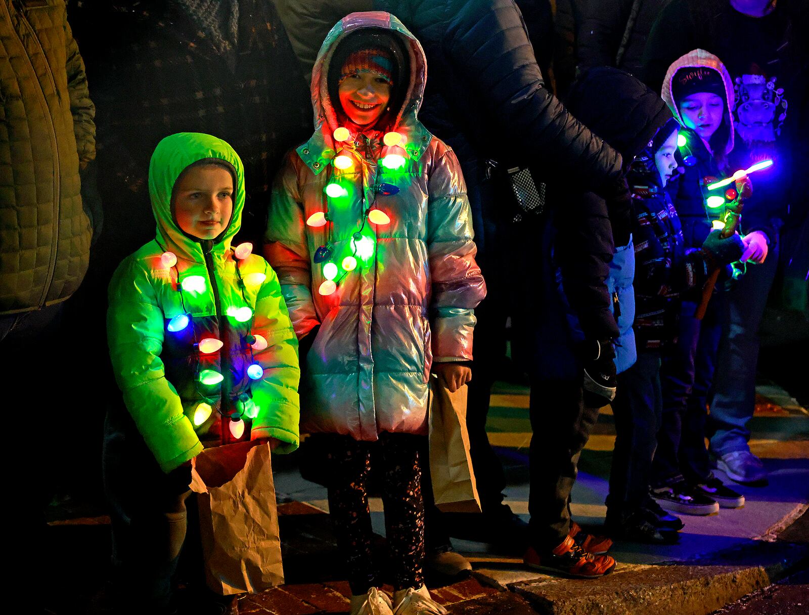 Kids wait for Santa to arrive Friday, Nov. 29, 2024 during the Holiday in the City Grand Illumination. BILL LACKEY/STAFF