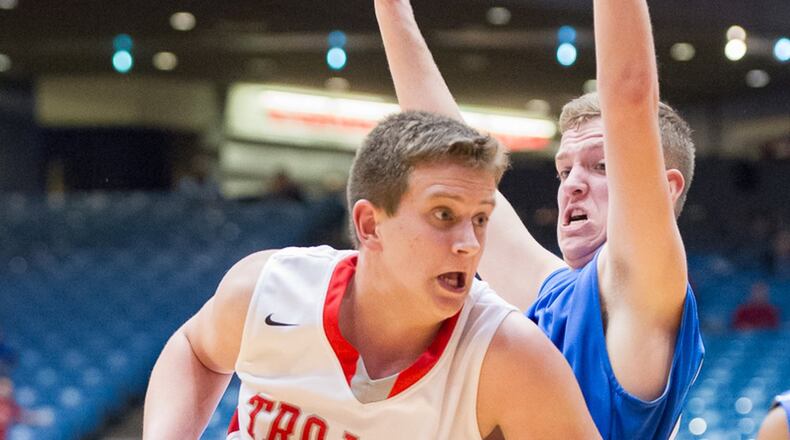 Southeastern’s Chase Billett shoots with pressure from Cincinnati Christian’s Daniel Nimmo during a Division IV district final on Friday at UD Arena. BRYANT BILLING / CONTRIBUTED
