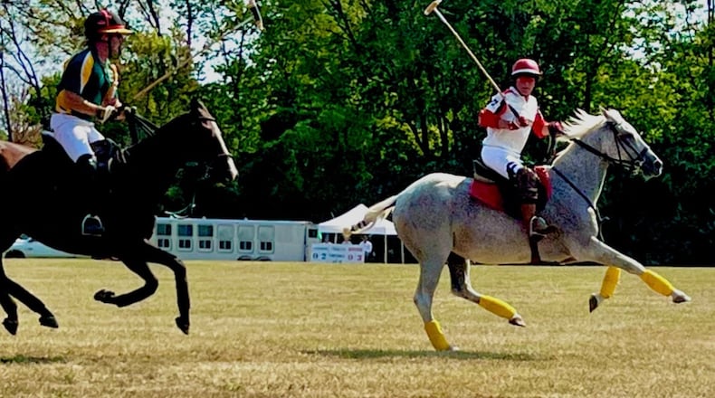Casey Koehler (left) riding for Springfield in hot pursuit of Keith Potter (right) of Cincinnati, in the Springfield Polo Club’s 100th anniversary match. Contributed