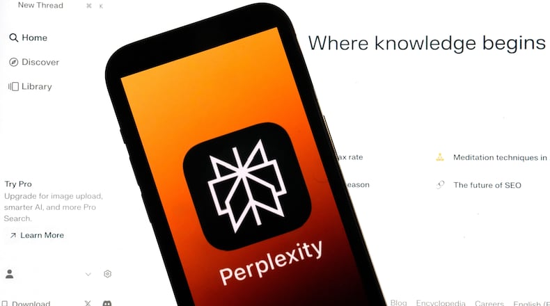 FILE - The Perplexity website and logo are shown in this photo, in New York, Friday, July 5, 2024. (AP Photo/Richard Drew, File)