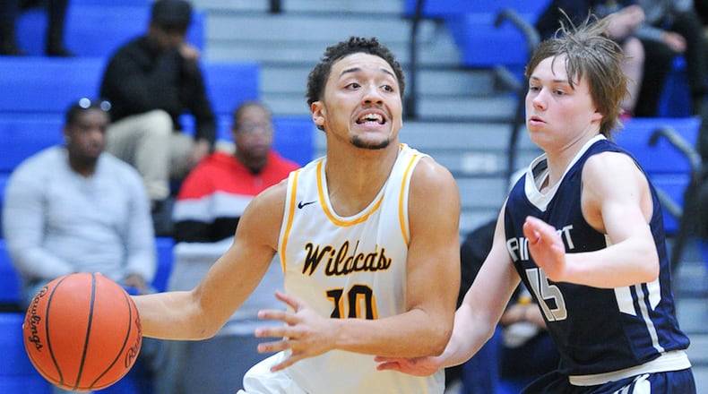 Springfield senior guard Danny Davis dribbles with pressure from Fairmont’s Jack Hendricks during a GWOC National East game. BRYANT BILLING / CONTRIBUTED