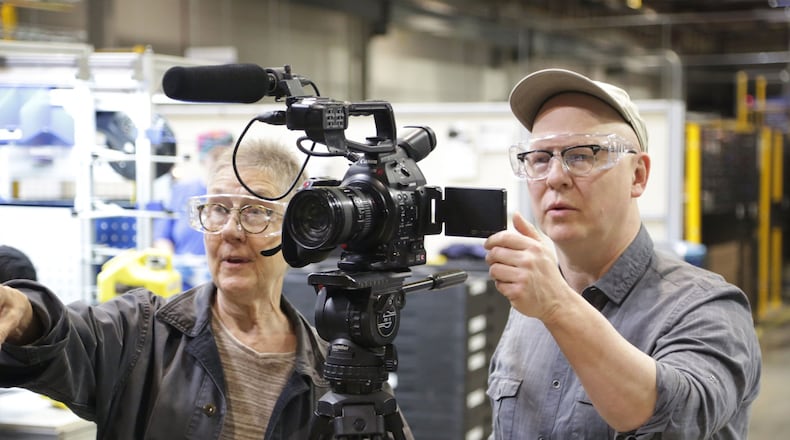 “American Factory” directors Julia Reichert (left) and Steven Bognar filming scenes at Fuyao. DAVID HOLM/NETFLIX