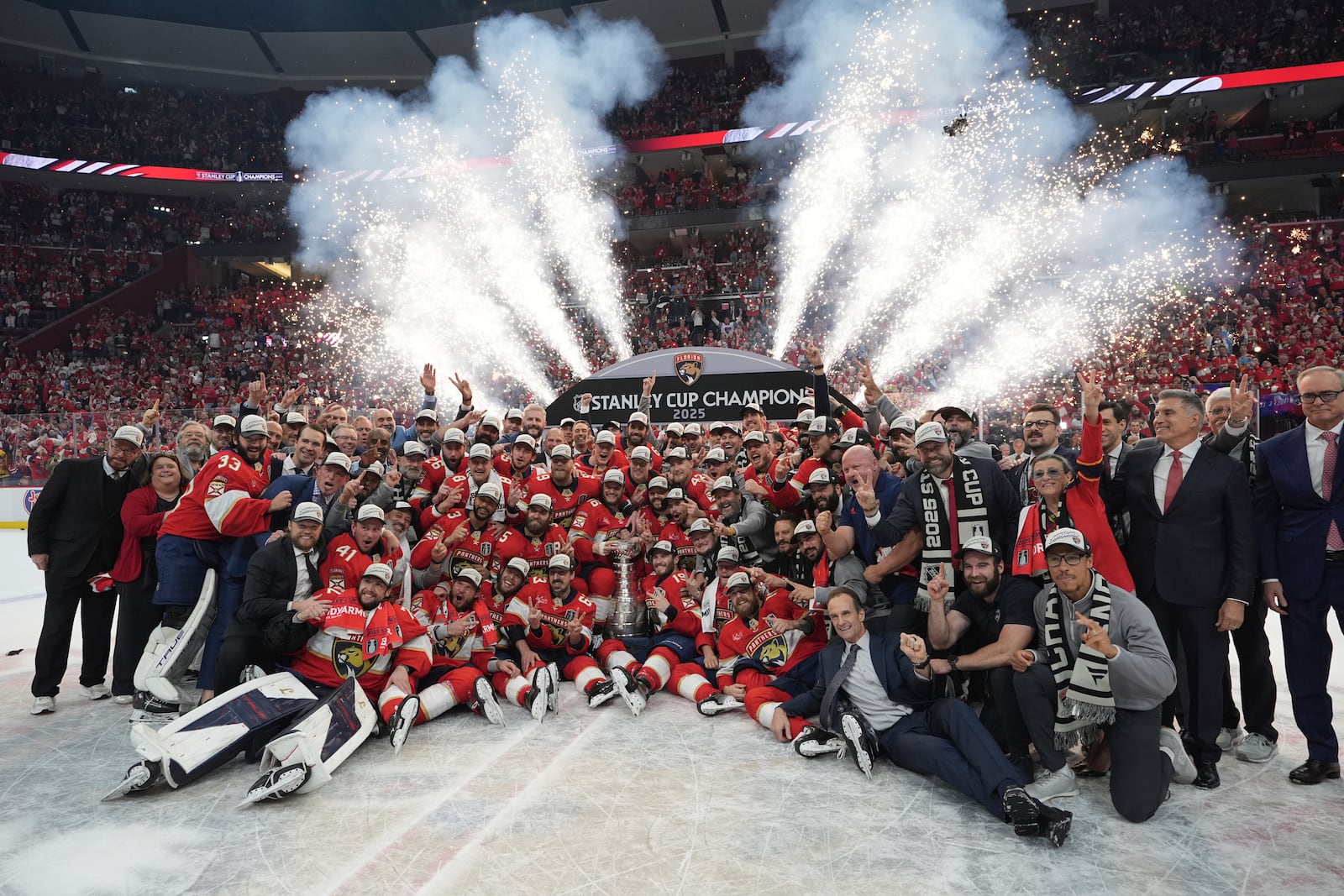 The Florida Panthers team poses with the Stanley Cup trophy after defeating the Edmonton Oilers in Game 6 of the NHL hockey Stanley Cup Final Tuesday, June 17, 2025, in Sunrise, Fla. (AP Photo/Lynne Sladky)