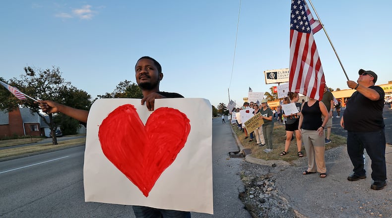 Petuel Jeanjacques, a Haitian immigrant, participates in a Peace Rally at the Clark County Democratic Party on Park Road in Springfield Wednesday, Sept. 18, 2024. BILL LACKEY/STAFF