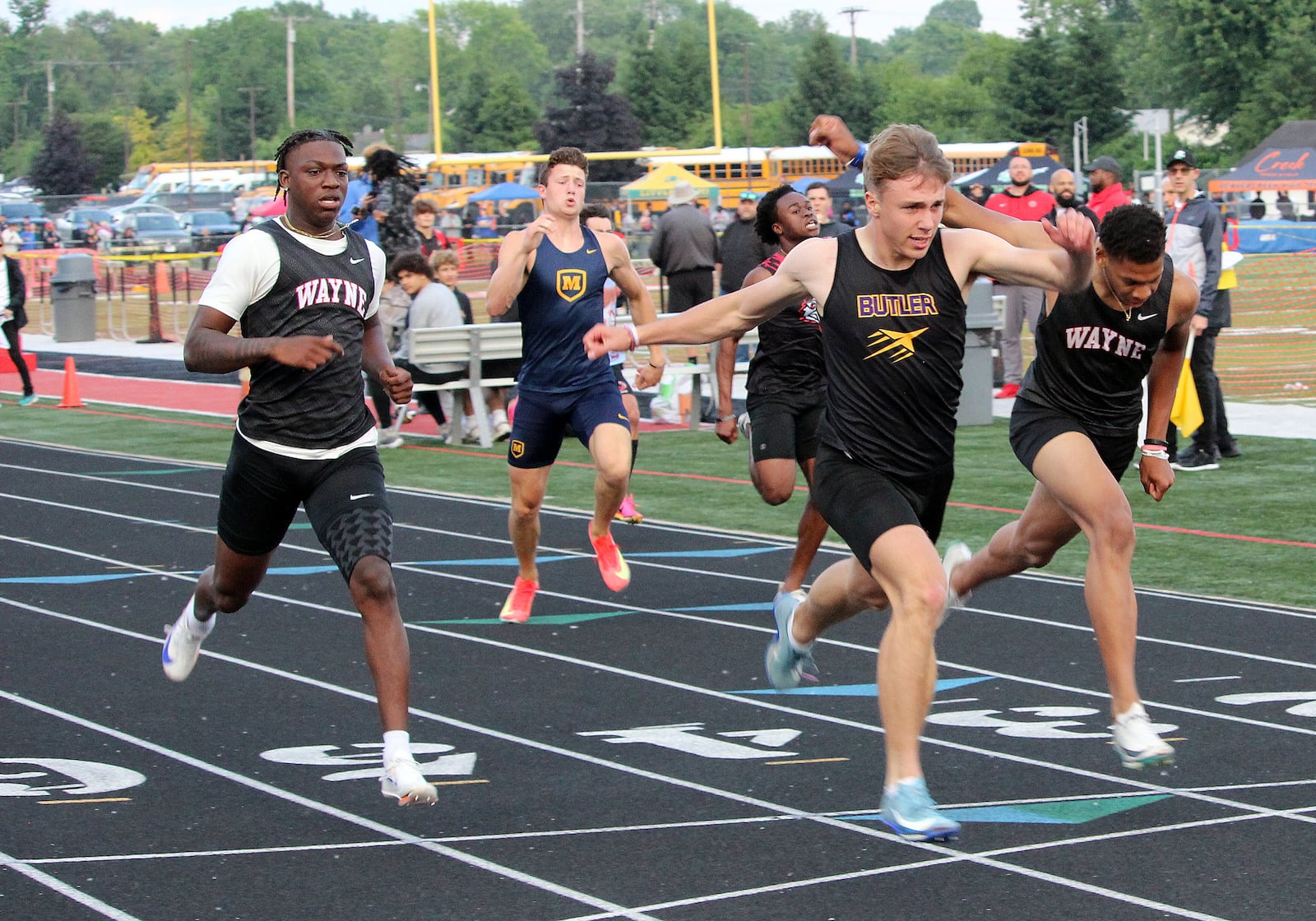 Butler's Jordan Gross (middle) wins the 200 during the during the Division I Region 4 track finals at Wayne's Heidkamp Stadium. HENRY S. CONTE / CONTRIBUTED PHOTO