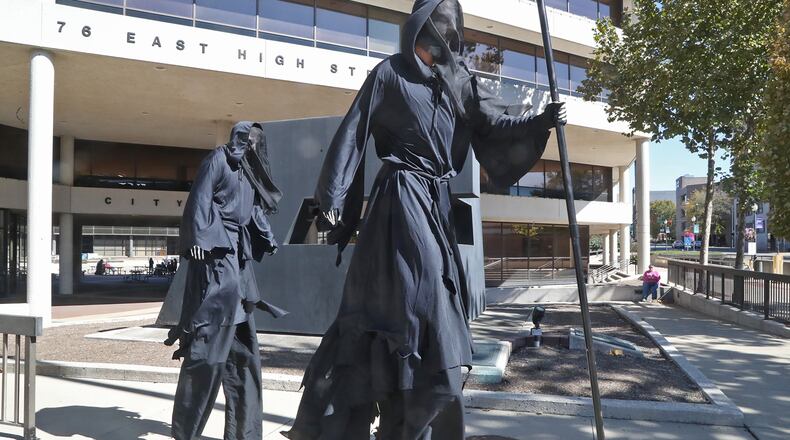 Springfield’s Wizarding Weekend, put on by the Clark County Historical Society at their Heritage School of Wizardry, brought some interesting characters from the world of Harry Potter to Springfield, including two 9-foot-tall dementors, who were roaming around the downtown area looking for souls to suck out of the crowd of participants Saturday, Oct. 8, 2022.
The dementors were actually Daniel Gaertner and Alec West, who were walking around on stilts. According to Natalie Fritz, archivist and director of Collections Outreach & Social Media for the Clark County Historical Society, the event brought a good number of wizarding school students and adult alumni guests from the Harry Potter fandom downtown for each of the three events held Friday and Saturday.
Fritz said, “The weekend’s magical success couldn’t have been possible without partnerships with other downtown businesses, organizations and locations, and the help of many volunteers and local performers who made it possible to offer a wide variety of classes and activities.” BILL LACKEY/STAFF