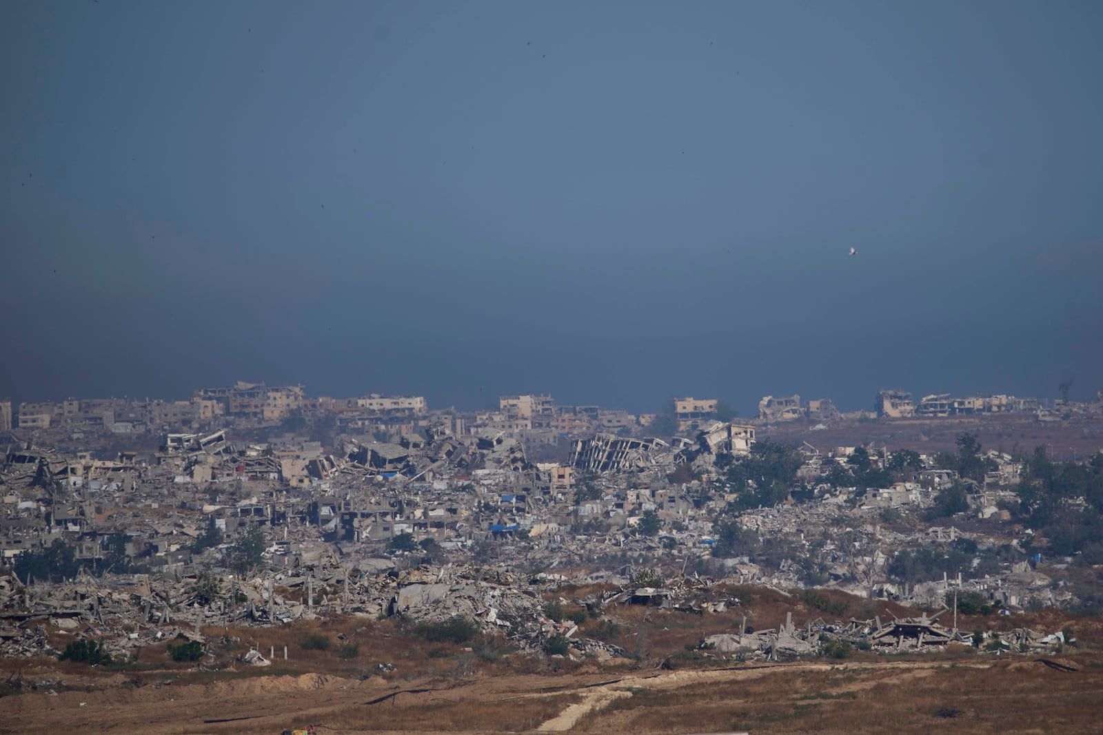 Destroyed buildings in the Gaza Strip as seen from southern Israel, Tuesday, May 6, 2025. (AP Photo/Ohad Zwigenberg)