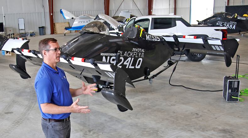 Josh Lane, flight test engineer and site manager, talks about the PIVOTAL Blackfly electric aircraft Monday, June 17, 2024 at the National Advanced Air Mobility Center of Excellence at Springfield-Beckley Municipal Airport. BILL LACKEY/STAFF