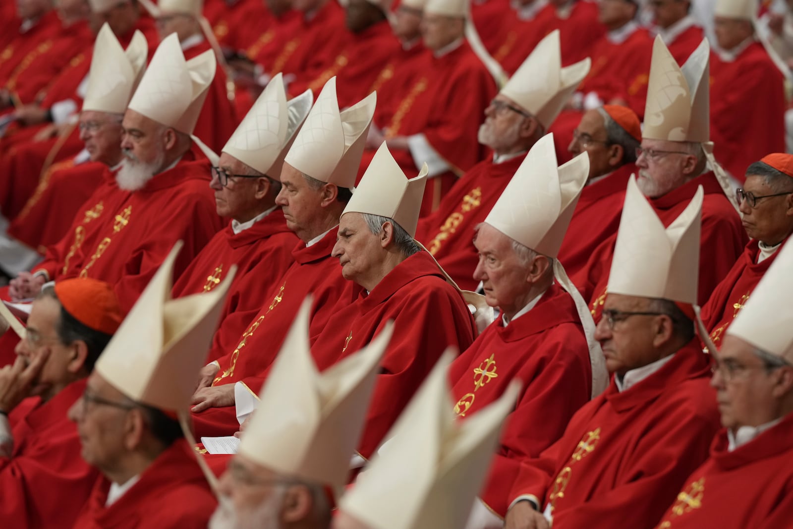 Cardinal Matteo Zuppi, centre, attends a mass on the third of nine days of mourning for late Pope Francis, in St. Peter's Basilica at the Vatican, Monday, April 28, 2025. (AP Photo/Andrew Medichini)