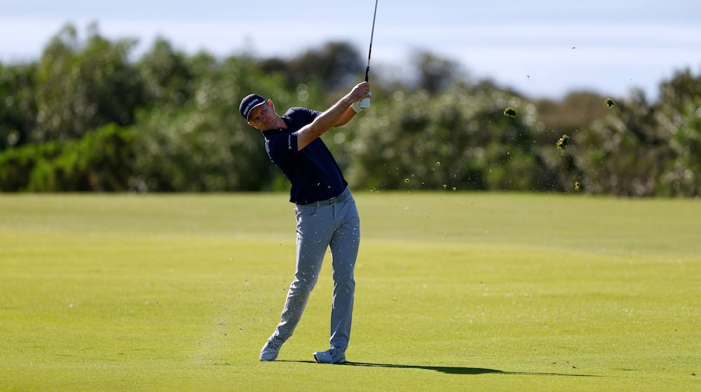 Justin Rose, of England, hits from the 17th fairway while playing the South Course at Torrey Pines during the second round of the Farmers Insurance Open golf tournament Friday, Jan. 30, 2026, in San Diego. (AP Photo/Caroline Brehman)