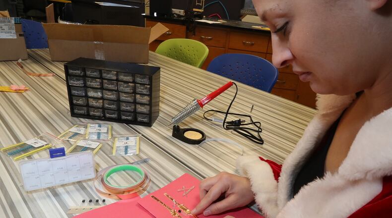 Rene Stratton, program coordinator at the Career Connect Ed Center, demonstrates one of the simple electronics projects that students will learn in January in the Maker Space room at The Dome. Bill Lackey/Staff