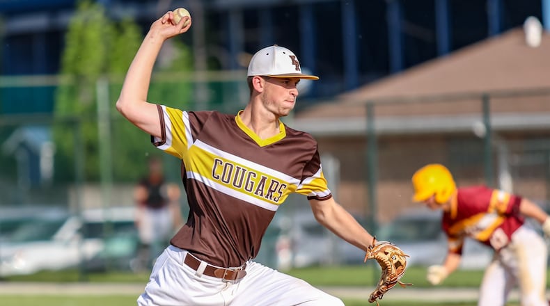 Kenton Ridge junior Collin Perkins pitches during a Division II district final game against Hamilton Ross on Thursday afternoon at Hamilton High School. The Cougars lost 1-0. CONTRIBUTED PHOTO BY MICHAEL COOPER