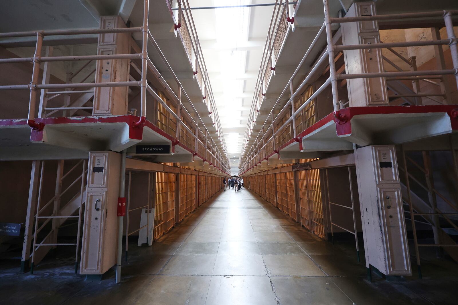 Visitors tour the prison cells on Alcatraz Island Monday, May 5, 2025, in San Francisco. (AP Photo/Jed Jacobsohn)