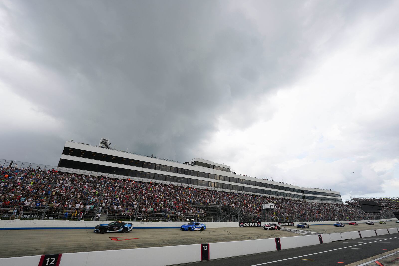 Denny Hamlin (11) drives behind the pace car during a yellow flag for rain during a NASCAR Cup Series auto race at Dover Motor Speedway, Sunday, July 20, 2025, in Dover, Del. (AP Photo/Derik Hamilton)