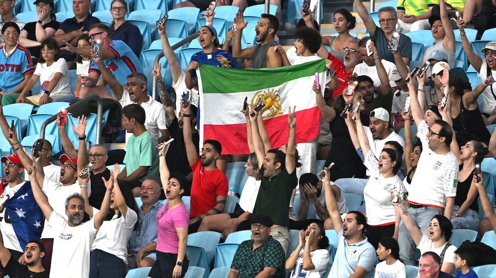 Iranian supporters react during the Women's Asia Cup soccer match between Iran and South Korea on the Gold Coast, Australia, Monday, March 2, 2026. (Dave Hunt/AAPImage via AP)