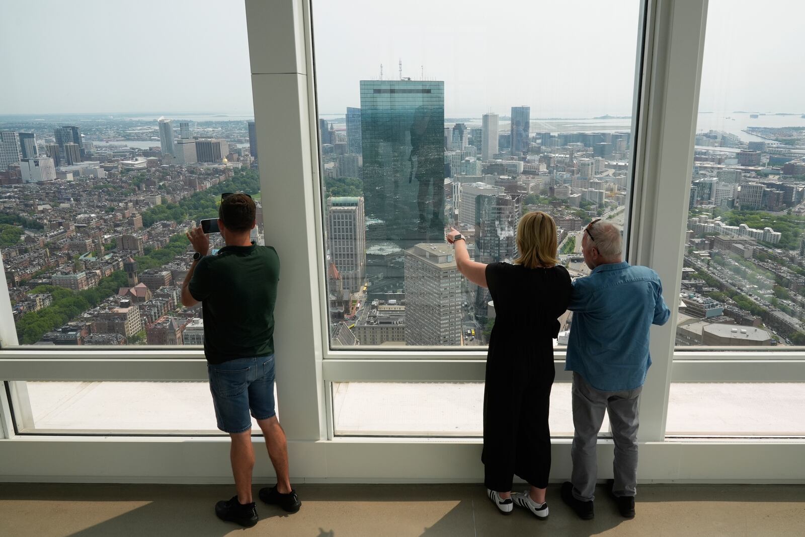Hazy skies diminish the view from the View Boston observatory, Wednesday, June 4, 2025, in Boston, Mass. (AP Photo/Robert F. Bukaty)