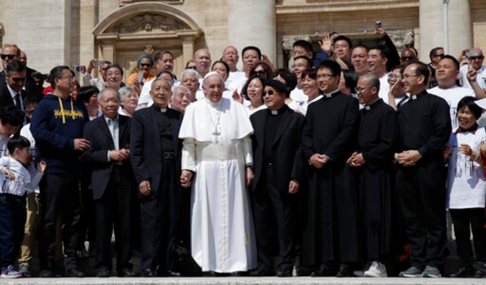 FILE - Pope Francis poses a group of faithful and bishops from Shanghai during his weekly general audience in St. Peter's square at the Vatican Wednesday, May 22, 2019. (AP Photo/Alessandra Tarantino, File)