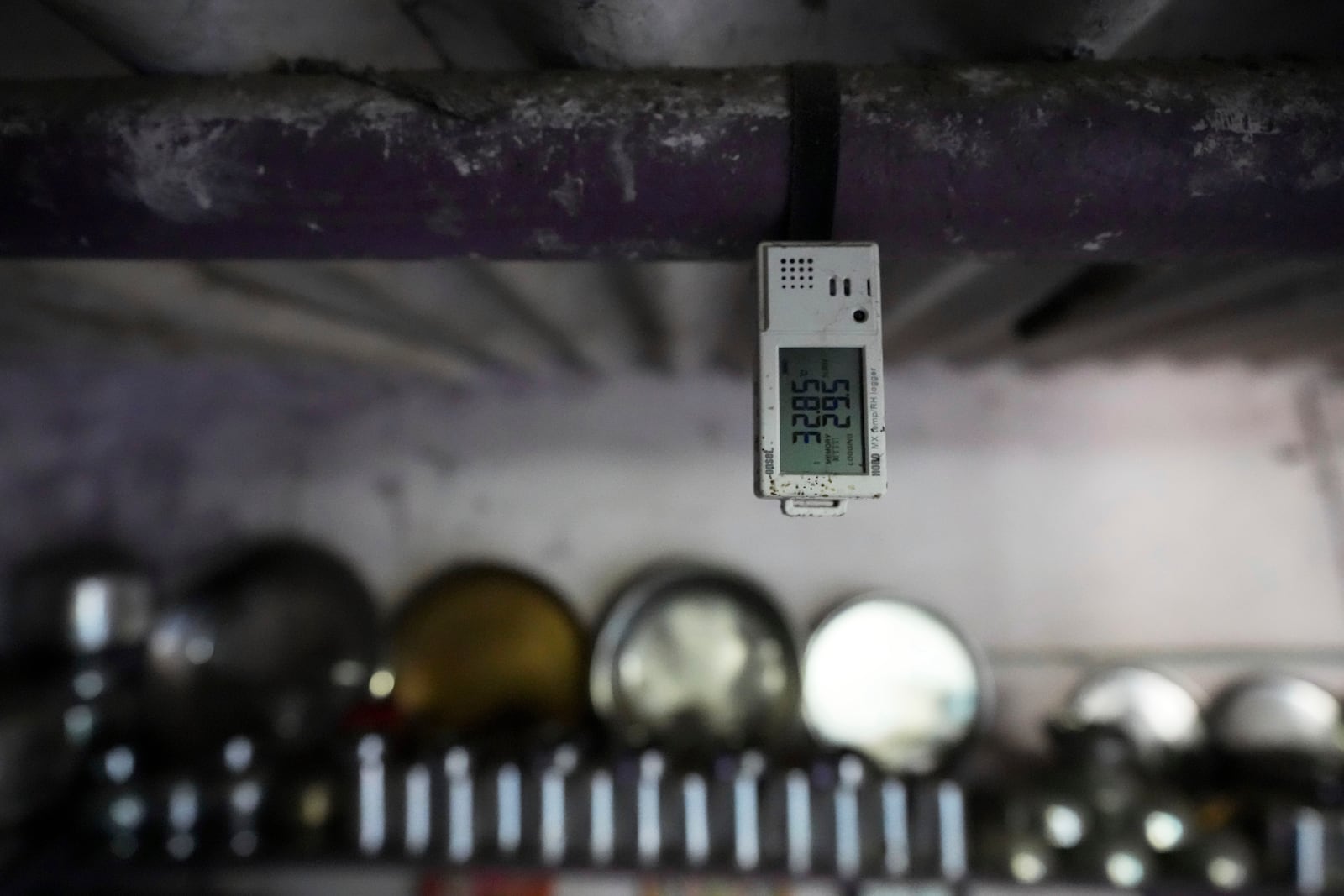 A device that tracks the temperature and other data is tied to the roof of a home in Vanzara Vas, a low-income neighborhood, in Ahmedabad, India, Wednesday, April 2, 2025. (AP Photo/Ajit Solanki)