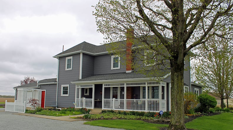 Situated on 2.48 acres, this Champaign County home has about 2,420 sq. ft. of living space. The property includes a bank barn and greenhouse. CONTRIBUTED PHOTO BY VICKIE KAPNAS
