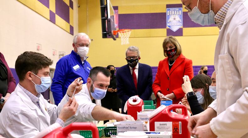 Gov. Mike DeWine and his wife, Fran, visit a COVID-19 vaccination clinic at Thurgood Marshall High School in Dayton on Sunday/ CONTRIBUTED