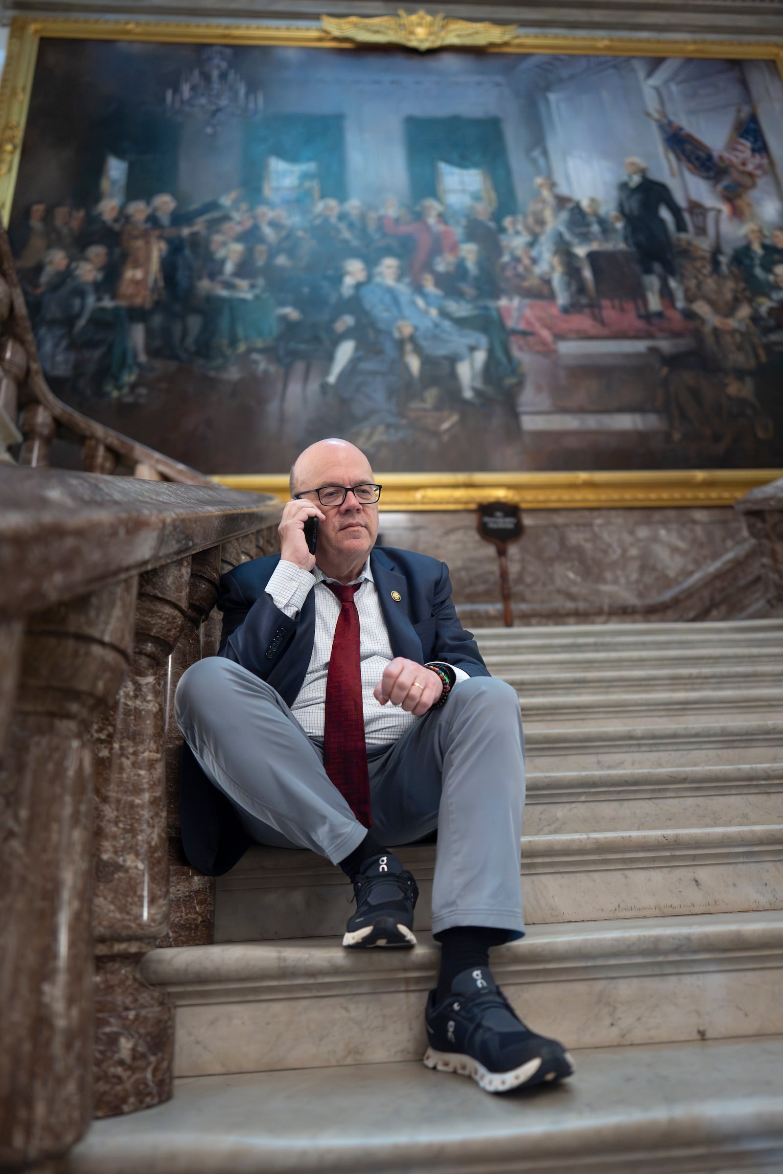 Rep. Jim McGovern, D-Mass., the top Democrat on the House Rules Committee, waits on the marble stairway outside the House chamber before the vote on President Donald Trump's signature bill of tax breaks and spending cuts, at the Capitol in Washington, Thursday, July 3, 2025. (AP Photo/J. Scott Applewhite)