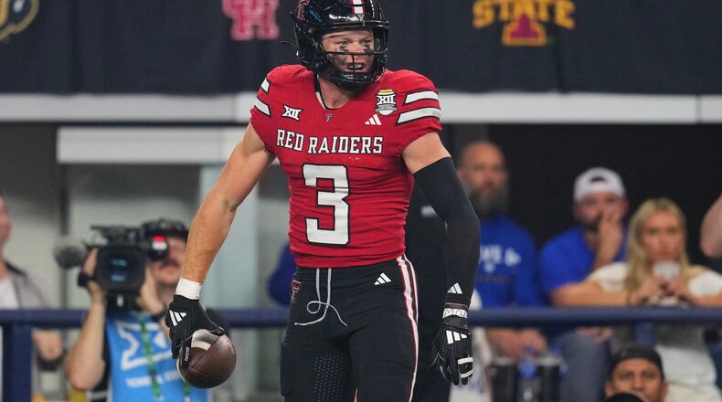 Texas Tech wide receiver Coy Eakin celebrates after catching a touchdown pass in the first half of a Big 12 Conference championship NCAA college football game against BYU Saturday, Dec. 6, 2025, in Arlington, Texas. (AP Photo/Julio Cortez)