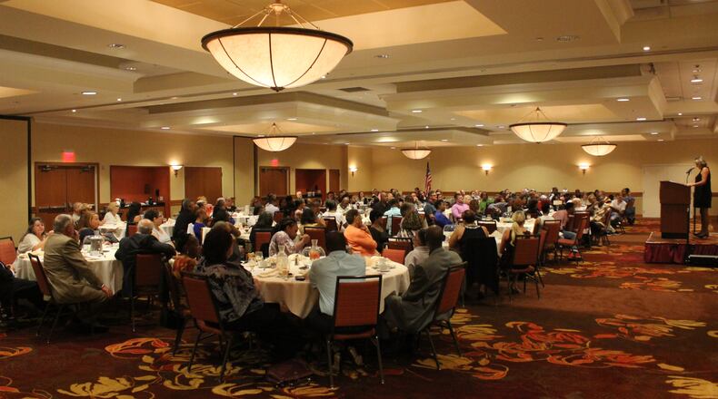 Carey McKee, a McKinley Hall board member, speaks to the crowd about her family’s experience with addiction at the sixth annual Recovery Works banquet in 2017 at the Courtyard by Marriott in downtown Springfield. MICHAEL COOPER/STAFF