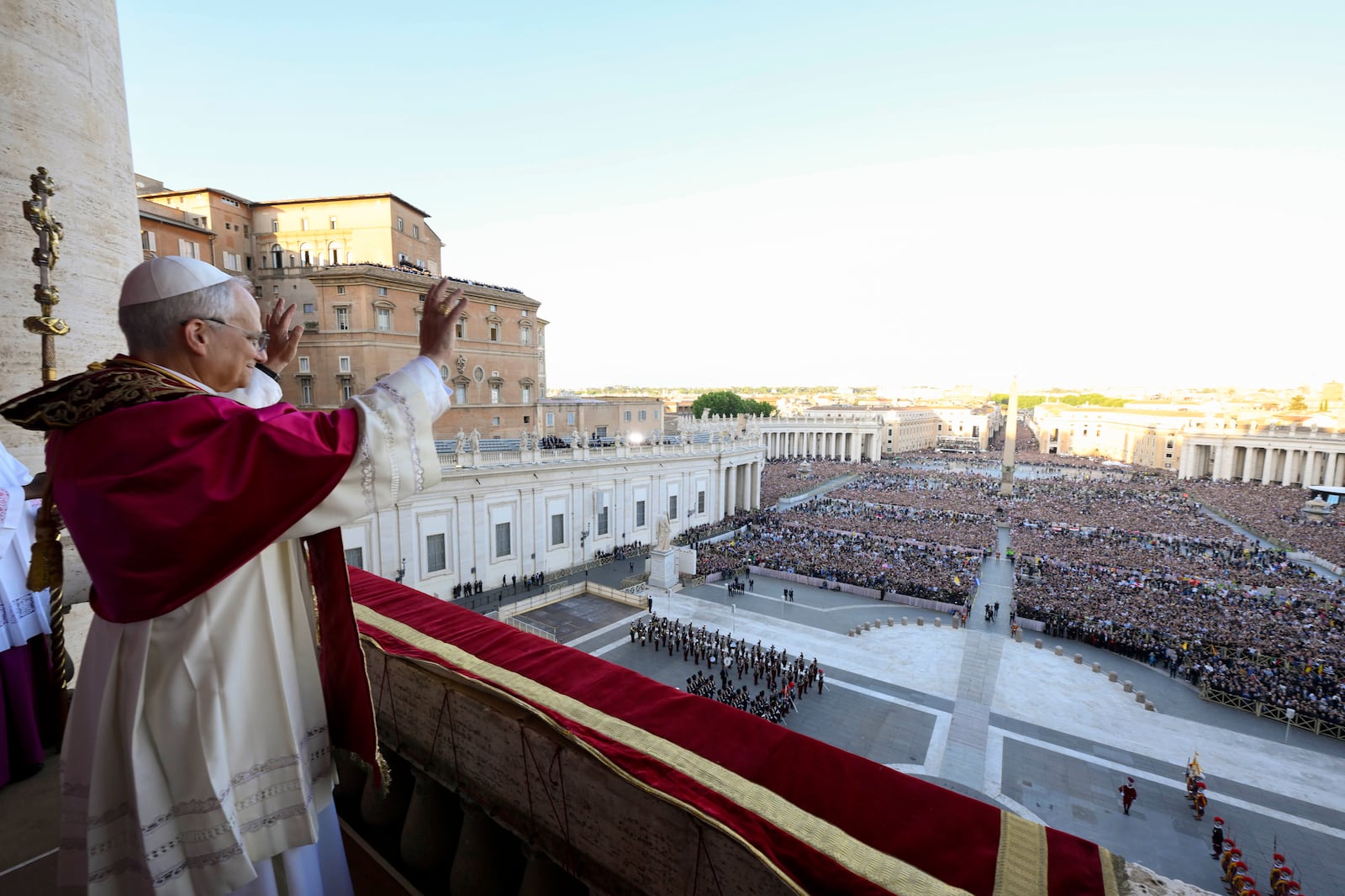 Newly elected Pope Leo XIV waves to faithful and pilgrims gathered in St. Peter's Square shortly after his election, Thursday, May 8, 2025. (Vatican Media via AP)