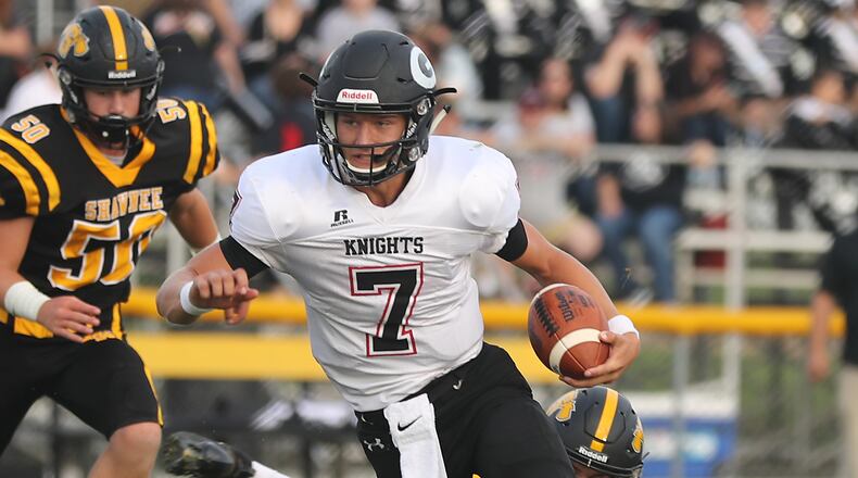 Greenon quarterback Cade Rice avoids being tackled by Shawnee's Pete Mueller as he carries the ball during a game last season. Rice is transferring to Northmont from Greenon. BILL LACKEY/STAFF