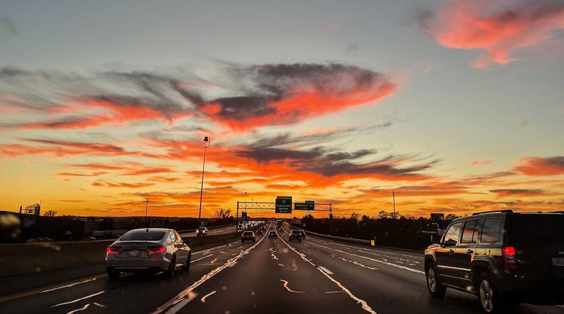 Vehicles travel on Interstate 75 near Dayton during a late autumn sunset. Thanksgiving holiday traffic is expected to be heavy from the day before Thanksgiving until the Sunday after the holiday with 1.9 million Ohioans expected to travel by motor vehicle.  JIM NOELKER/STAFF