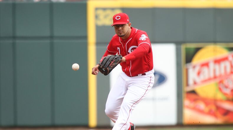 Reds third baseman Eugenio Suarez fields a ball against the Nationals on Saturday, March 31, 2018, at Great American Ball Park in Cincinnati. David Jablonski/Staff