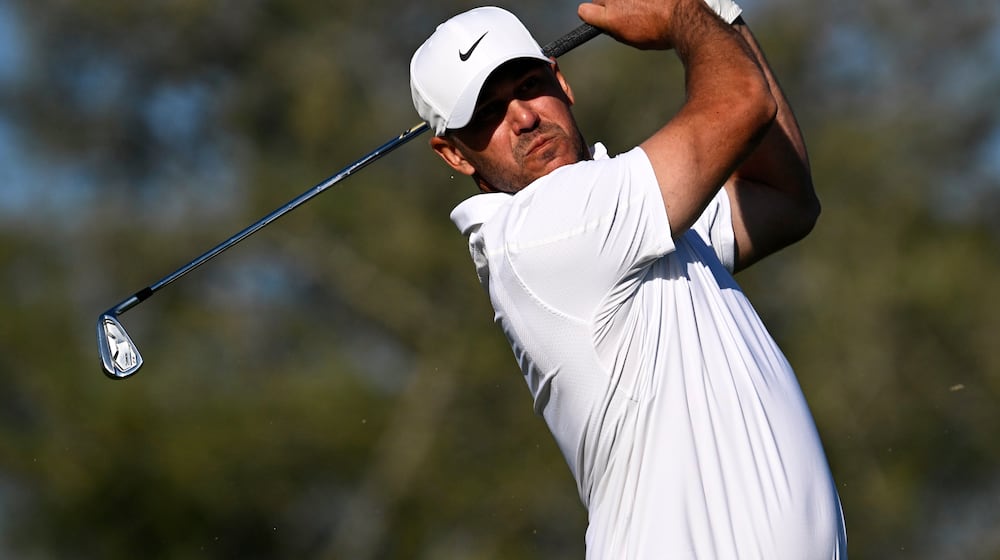 Brooks Koepka tees off on the eighth hole while playing the North Course at Torrey Pines during the second round of the Farmers Insurance Open golf tournament Friday, Jan. 30, 2026, in San Diego. (AP Photo/Denis Poroy)