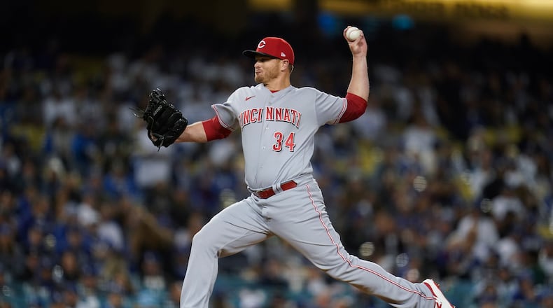 Cincinnati Reds relief pitcher Justin Wilson (34) throws during the seventh inning of a baseball game against the Los Angeles Dodgers in Los Angeles, Thursday, April 14, 2022. (AP Photo/Ashley Landis)