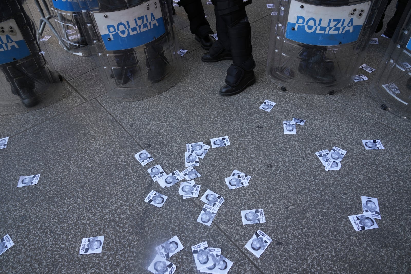 People ask for the resignation of Milan's Mayor Giuseppe Sala outside the City Council Monday, July 21, 2025, in Milan, northern Italy, as prosecutors are investigating more than 70 individuals, including Mayor Sala, over a sprawling corruption probe into the city's real estate industry. (AP Photo/Antonio Calanni)