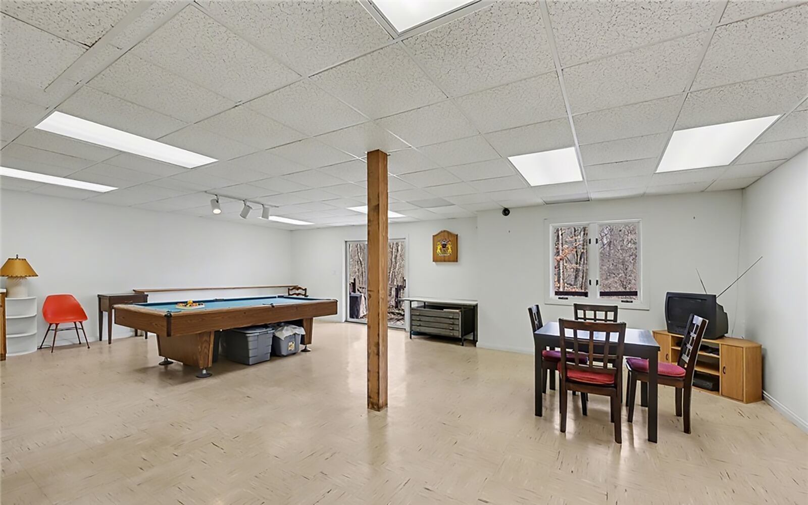 The finished basement features a recreation room with a sliding glass door walking out to the yard and patio. It has track lighting and there is a full bathroom next to this room. CONTRIBUTED