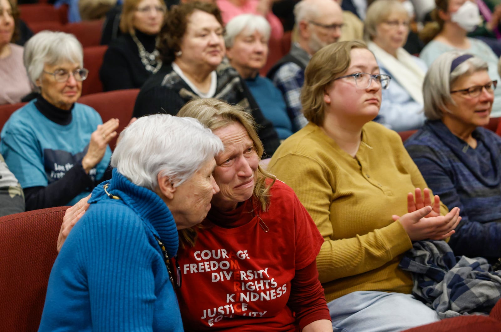 Audience members comfort each other during Here We Stand: Faith Leaders for Immigration Justice & Family Unity at St. John Missionary Baptist Church on Monday, Feb. 2, 2026, in Springfield. Pastors, faith leaders and community members gathered to pray and call for the extension of Temporary Protected Status which is scheduled to expire on Tuesday, Feb. 3, 2026. JOSEPH COOKE/STAFF
