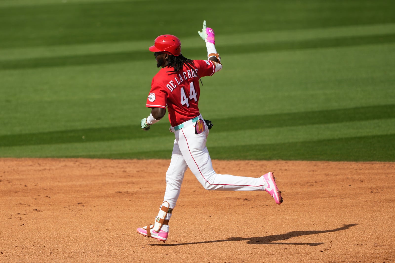 Cincinnati Reds' Elly de la Cruz celebrates after a solo home run against the Kansas City Royals during the fifth inning of a spring baseball game in Goodyear, Ariz., Tuesday, Feb. 24, 2026. (AP Photo/Chris Carlson)
