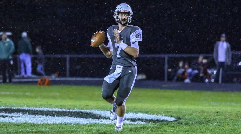 Greenon High School quarterback Cade Rice rolls out to throw a pass during their game against Madison Plains on Friday night at Greenon Stadium. The Knights won 24-16. CONTRIBUTED BY MICHAEL COOPER