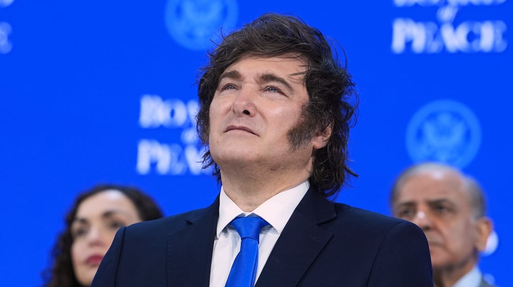 Javier Milei, President of Argentina, listens to speeches after the signing of a Board of Peace charter during the Annual Meeting of the World Economic Forum in Davos, Switzerland, Thursday, Jan. 22, 2026. (AP Photo/Evan Vucci)