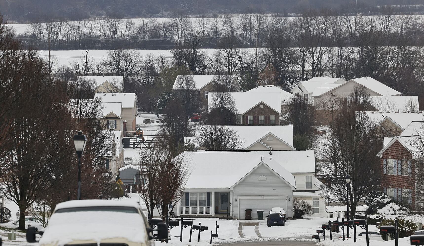 Monroe house covered in snow