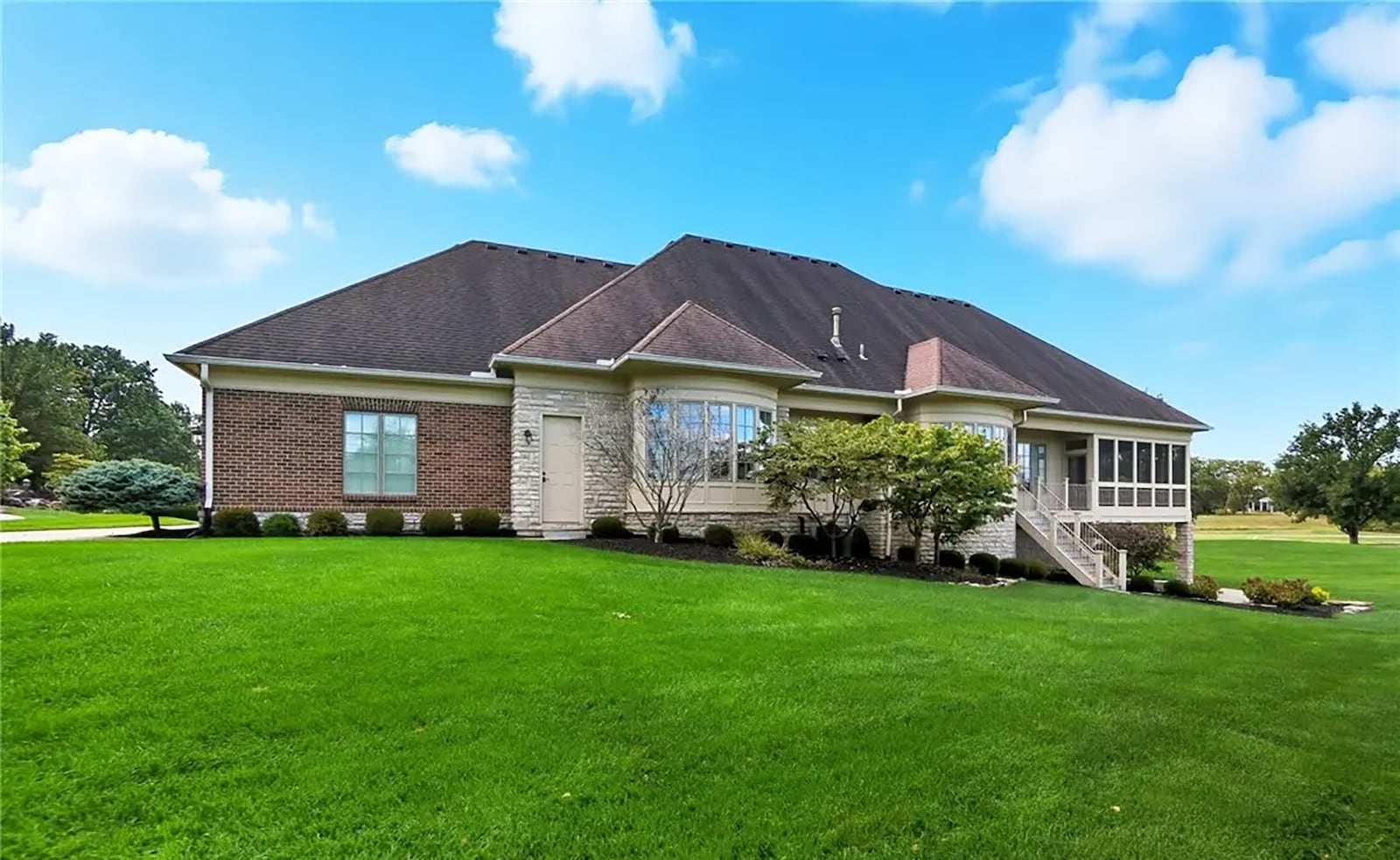 The back of the house has a screened in porch, covered deck and covered lower level patio, all overlooking the golf course. CONTRIBUTED