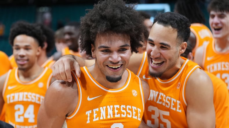 Tennessee guard Ja'Kobi Gillespie (0) and guard Ethan Burg (35) celebrate after Tennessee defeated Houston in an NCAA college basketball game in the Players Era tournament Las Vegas, Tuesday, Nov. 25, 2025. (AP Photo/Eric Gay)