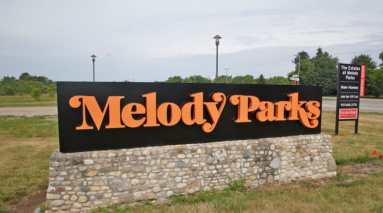A new permanent Melody Parks development sign has replaced the old NextEdge sign along U.S. 40 Friday, July 5, 2024. BILL LACKEY/STAFF