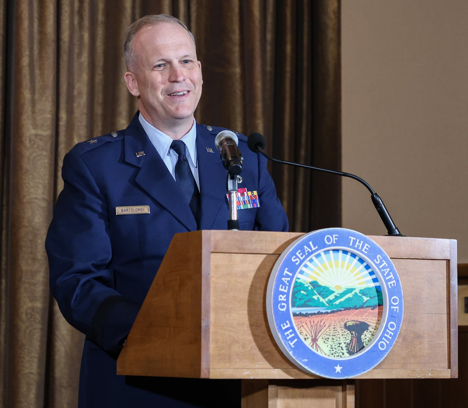 Brigadier General Jason Bartolomei speaks during an event on Monday at Pentagon Tower in Beavercreek. Bartolomei, along with Gov. Mike DeWine, signed a memorandum of understanding between the State of Ohio and Air Force Research laboratory to renew a partnership between the two entities to share science and technology information. BRYANT BILLING / STAFF