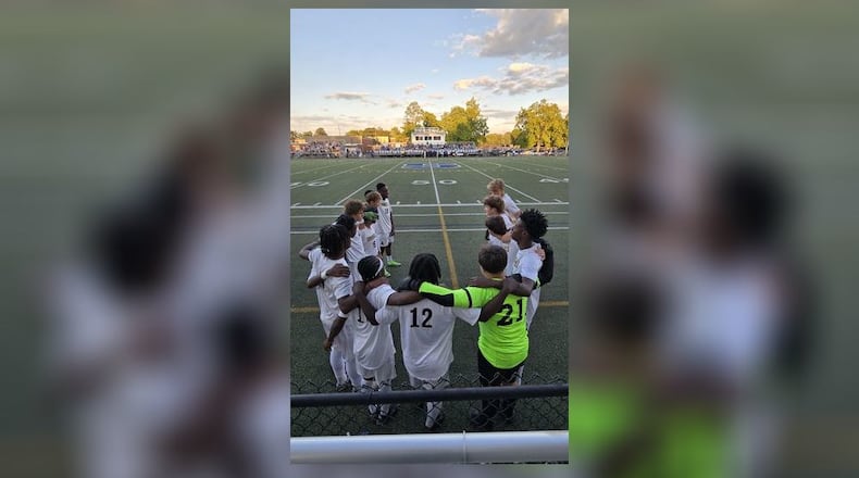 The Springfield High School boys soccer team stands together arm-in-arm before their game on Aug. 26, 2025 at Springboro. CONTRIBUTED PHOTO